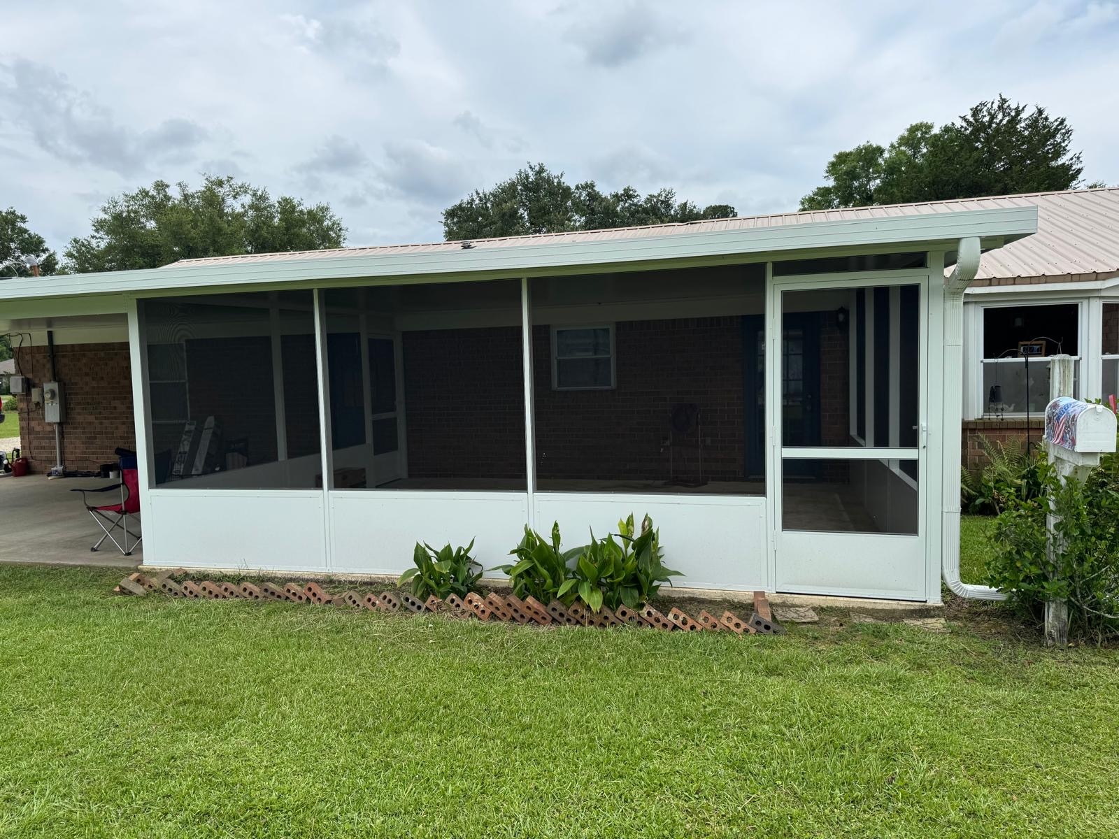 Superior Quality Custom Screen Room and Patio Cover room addition completed by Stonewall & Associates in Cantonment, FL Thumbnail